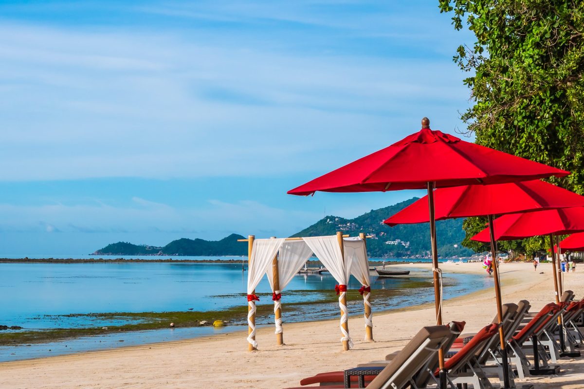 Umbrella and chair on the tropical beach sea and ocean for travel and vacation
